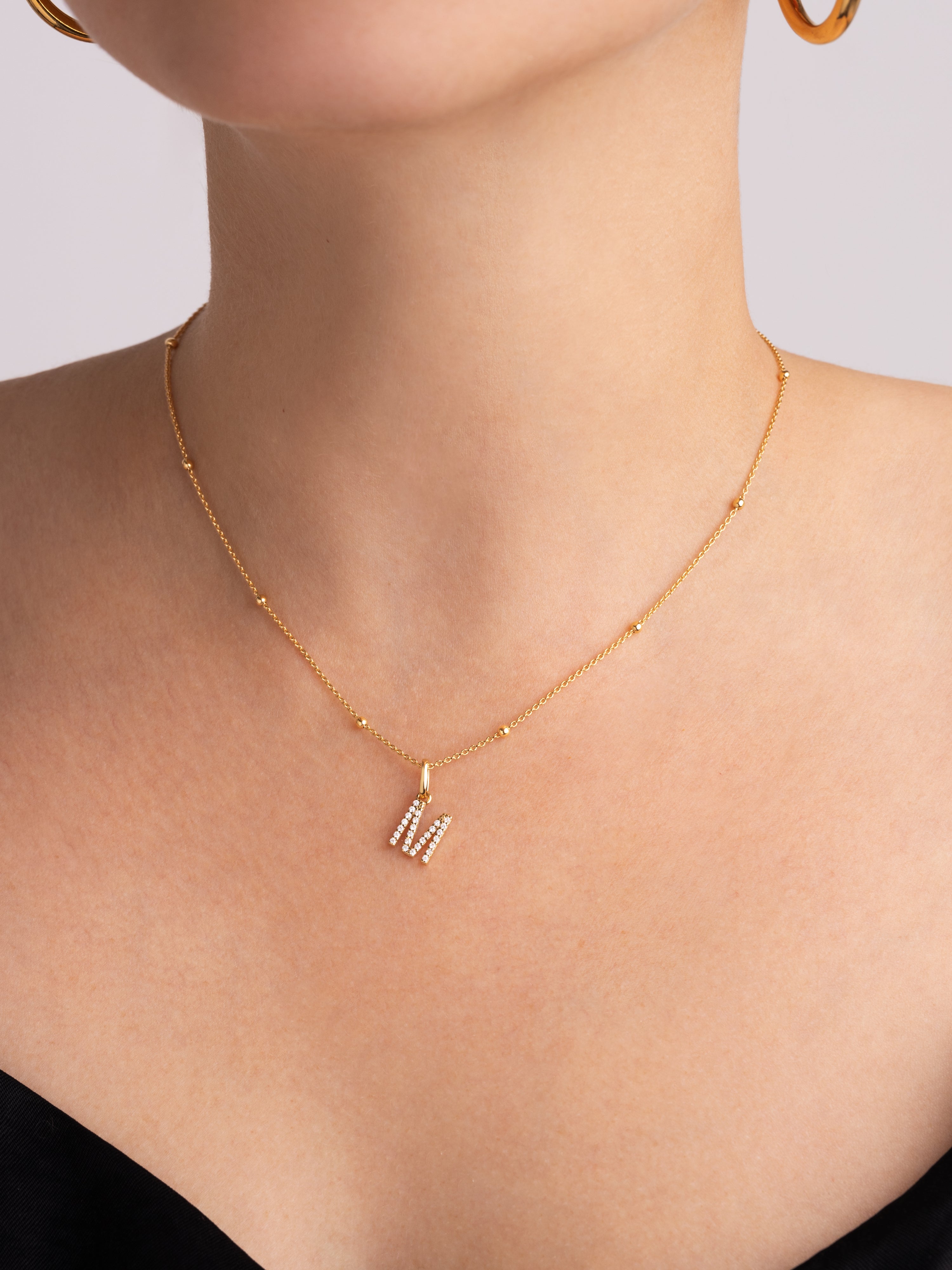 Letter Spark Gold Charm