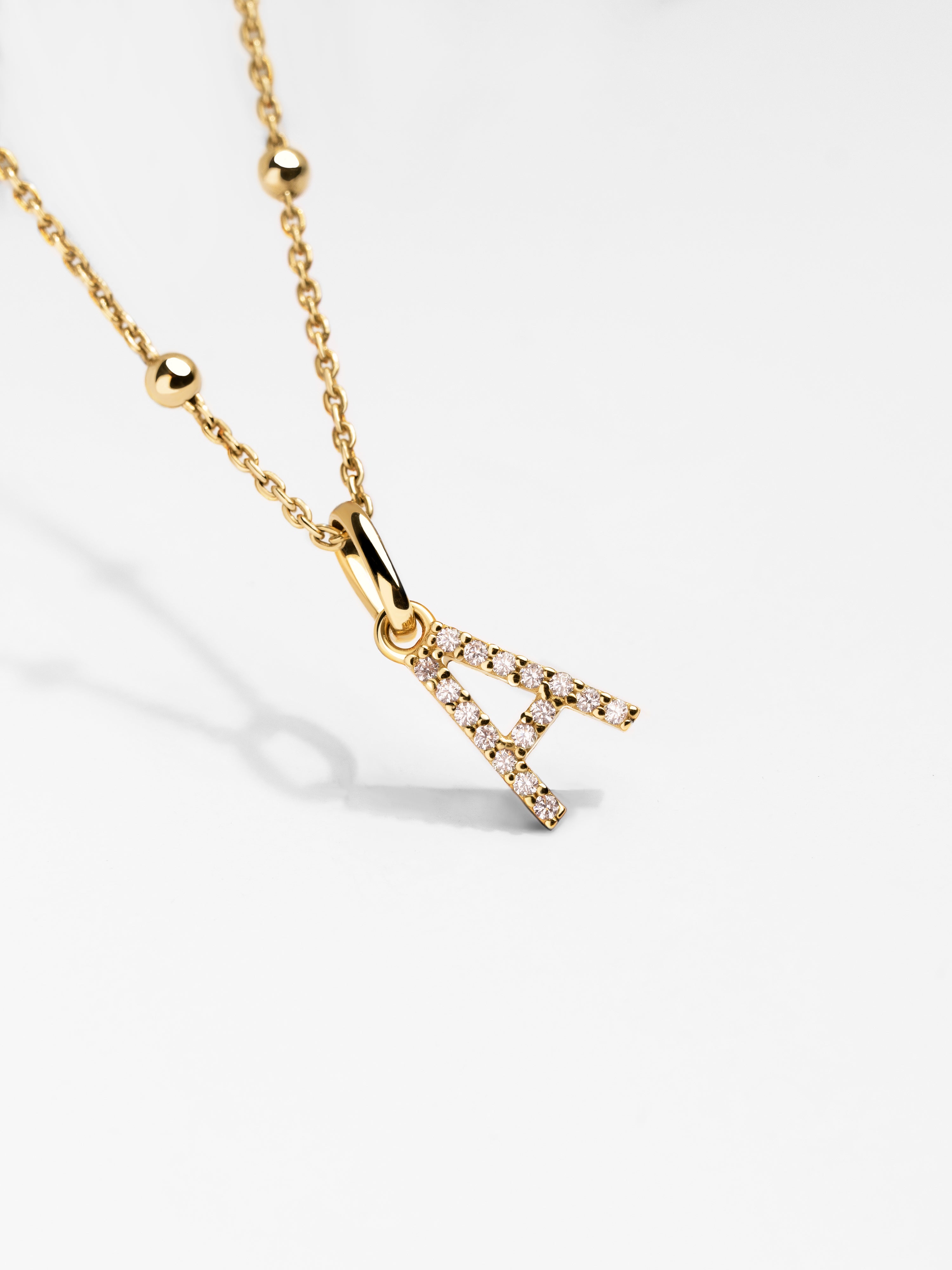 Letter Spark Gold Charm