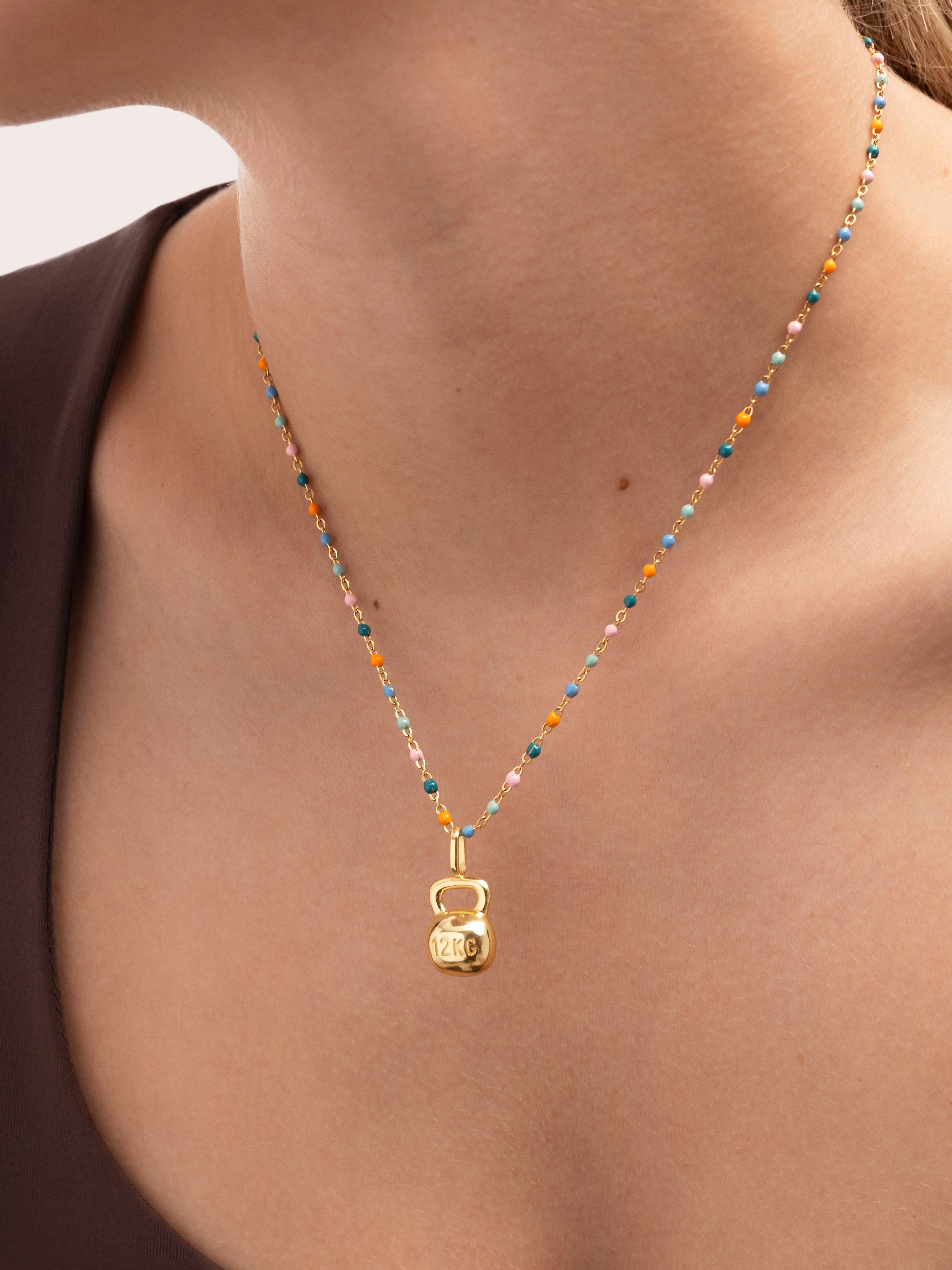 Charm Kettlebell Baño Oro